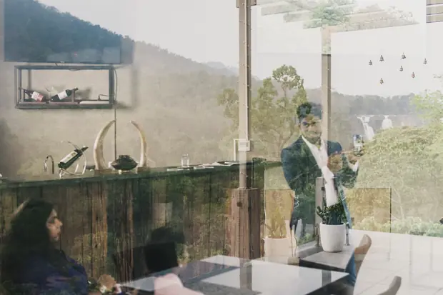 The venue's glass room with the hills visible through the far wall